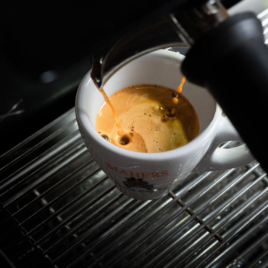 Espresso pouring into a Mahers cup